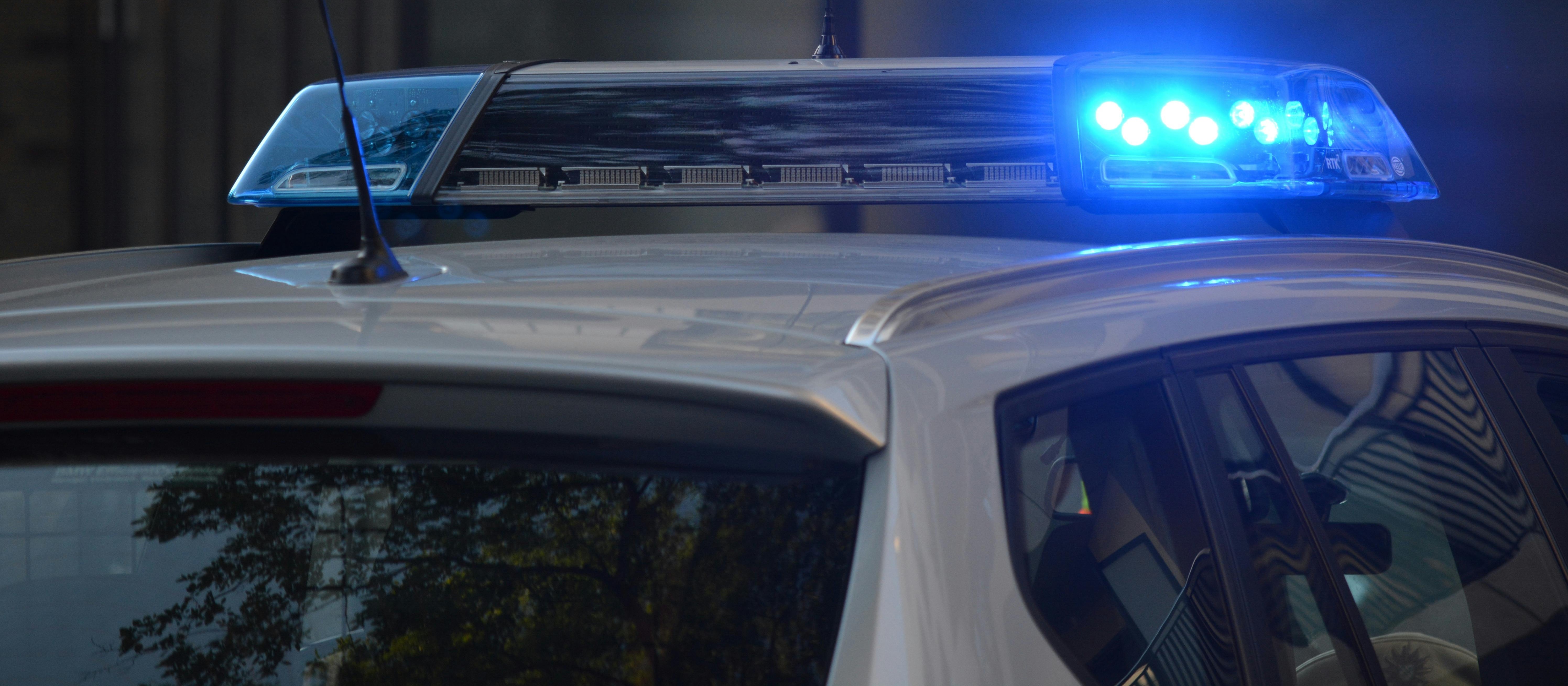 Police car with blue lights flashing